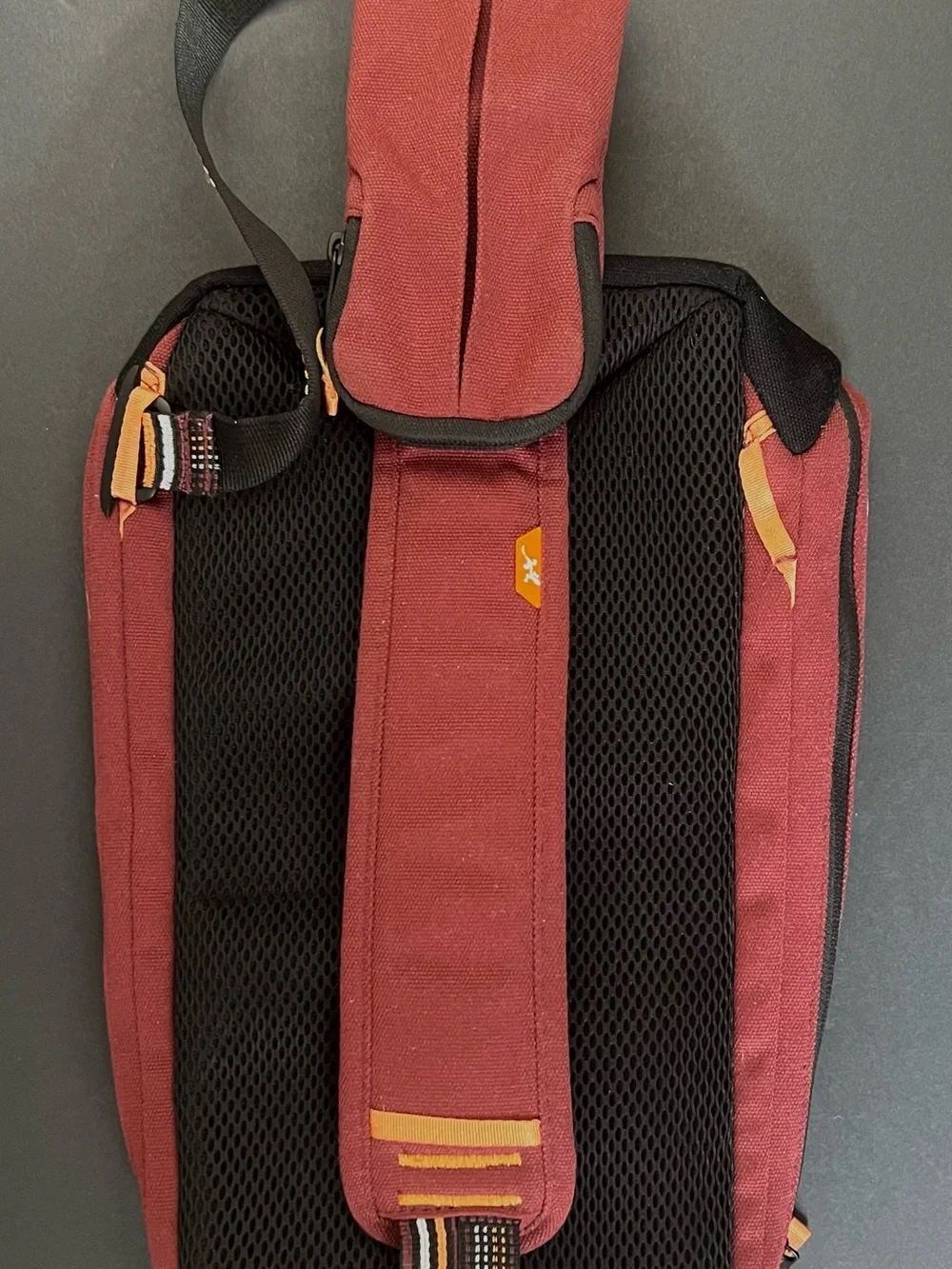 Chaco Men's Burgundy Red Sling Bag with Orange, Black and White Strap Detail